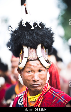 Naga tribesman in traditional outfit during the annual Hornbill Festival at Kisama, Kohima, Nagaland, India Stock Photo