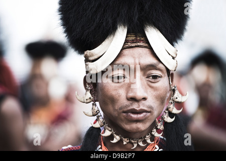 Naga tribesman in traditional outfit during the annual Hornbill Festival at Kisama, Kohima, Nagaland, India Stock Photo