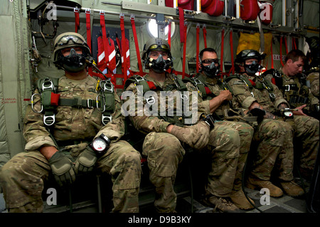 US Army Operational Detachment Alpha from 7th Special Forces Group waits onboard a C-130 to conduct a high altitude low opening parachute jump with members of the Canadian Special Operations Regiment and Para-Rescue Airmen from the Air forces Special Operations Command April 25, 2013 at Hurlburt Field, FL. Stock Photo