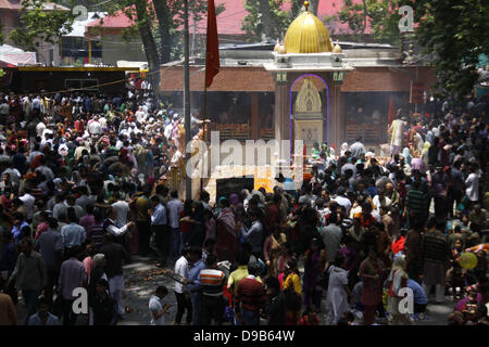 June 17, 2013 - Kashmiri (Pandit) Hindu devotee  prays at the Kheer Bhawani Temple at Tulla Mulla Ganderbal, northeast of Srinagar,the summer capital of indian   kashmir  ,on Monday 17/6/2013. Thousands of Hindu devotees attended the prayers in the historic Kheer Bhavani Temple. A large portion of Hindu community (locally called Pandits) migrated from the Muslim majority areas of the Indian Kashmir to Jammu city and northern states of India after anti-Indian armed insurgency broke down in the region in 1989. At least 219 Kashmiri Hindus were killed in the two decade long militancy in the regio Stock Photo