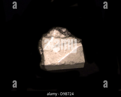 Moon rock - 128 grams (part of a 5.5 kilo boulder) is a piece of our nearest planetary neighbour, the moon, collected by the astronauts of the Apollo 16 mission in April 1972. Stock Photo