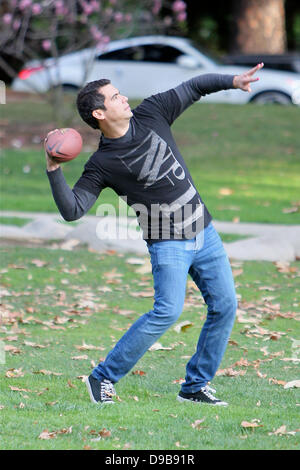 Cash Warren clearly has his work cut out for him living with three girls. Jessica Alba's husband, who has two daughters with the actress, sported pink nail polish on his left hand while trying to play a macho game of football during a family outing in Coldwater Park Beverly Hills, California - 12.02.12 Stock Photo