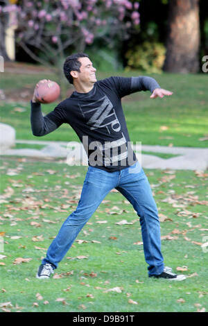 Cash Warren clearly has his work cut out for him living with three girls. Jessica Alba's husband, who has two daughters with the actress, sported pink nail polish on his left hand while trying to play a macho game of football during a family outing in Coldwater Park Beverly Hills, California - 12.02.12 Stock Photo