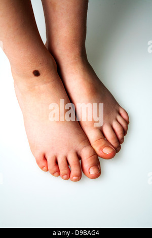 Four year old boy's feet Stock Photo