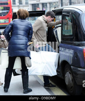 Stacey Solomon and boyfriend Aaron Barnham leaving after shopping at 'Mamas & Papas' London, England - 09.02.12 Stock Photo