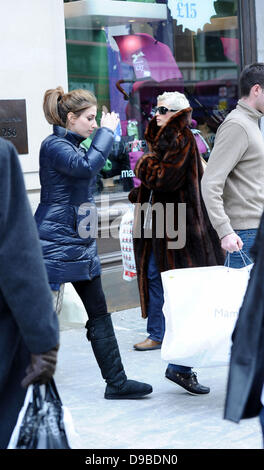 Stacey Solomon and boyfriend Aaron Barnham leaving after shopping at 'Mamas & Papas' London, England - 09.02.12 Stock Photo