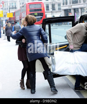 Stacey Solomon and boyfriend Aaron Barnham leaving after shopping at 'Mamas & Papas' London, England - 09.02.12 Stock Photo