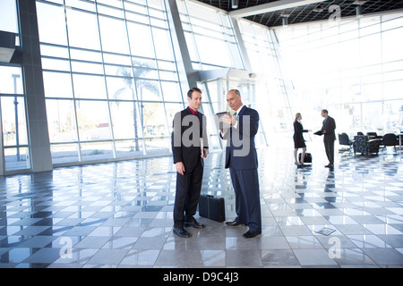 Two businessmen using digital tablet Stock Photo