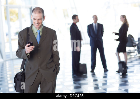 Businessman using cell phone Stock Photo