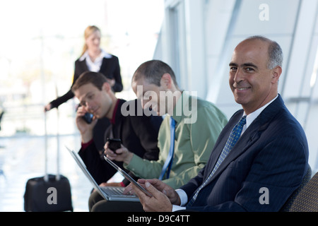 Mature businessman using digital tablet Stock Photo