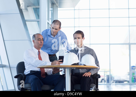 Engineers with model wind turbines Stock Photo