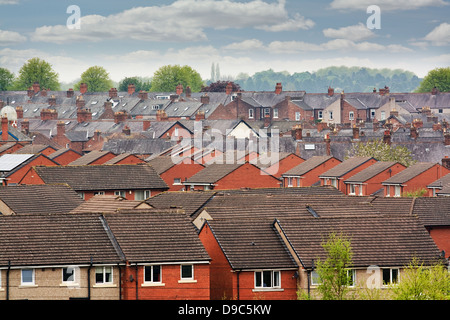 Urban scene across built up area showing the slate roof tops of terraced houses on an old housing estate Stock Photo