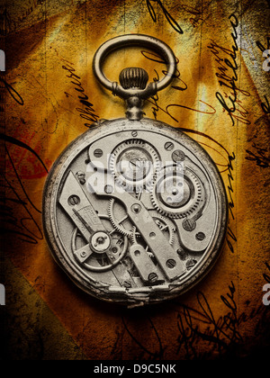 Pocket watch with open back on handwritten letter Stock Photo