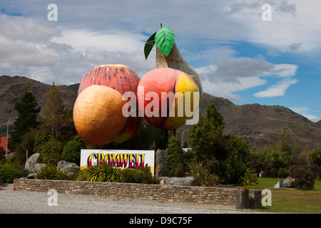 Sculpture of large pieces of fruit with a sign, Cromwell, South Island, New Zealand Stock Photo