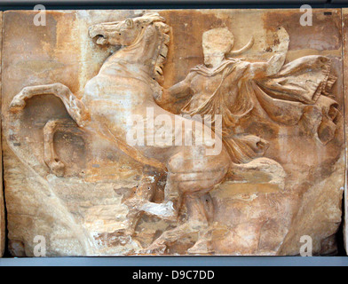 A powerful composition occupies the central block of the west frieze, which is possibly the work of Phidias. A horseman (15) tries to restrain his unruly horse by placing his right foot on a rock. Stock Photo