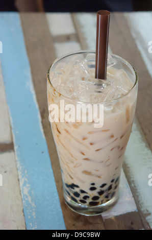 bubble milk tea ( Glass of milk tea with tapioca ) on wooden table Stock Photo