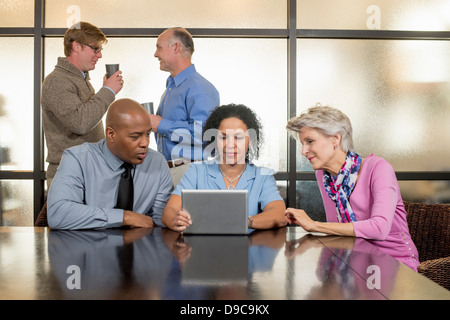 Business colleagues using digital tablet Stock Photo