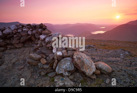 The summit of Robinson in the Lake District at Sunset. High Snockrigg, Loweswater Fell, Low Bank and Whiteless Pike in distance Stock Photo