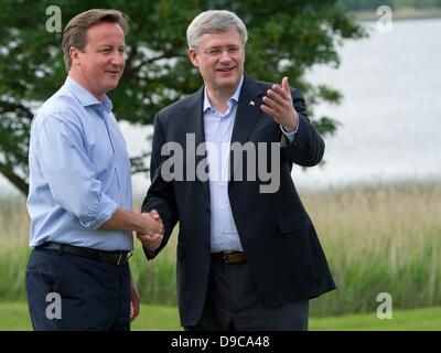 Enniskillen, Northern Ireland / Great Britain. 17th June, 2013. British Prime Minister David Cameron greets Canadian Prime Minister Stephen Harper (R) at the start of the G8 summit in Enniskillen, Northern Ireland / Great Britain, 17 June 2013. The G8 summit takes place in a golf hotel at Lough Erne on 17 and 18 June 2013. Photo: TIM BRAKEMEIER/dpa/Alamy Live News Stock Photo