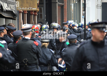 Police gather in numbers to evict squatters who had taken over the abandoned Beak Street police station in central London Stock Photo