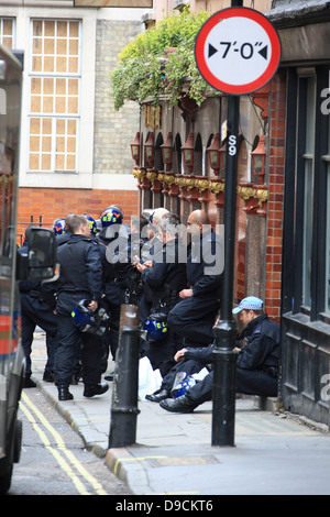 Police gather in numbers to evict squatters who had taken over the abandoned Beak Street police station in central London Stock Photo