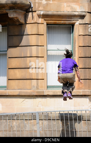 Young man practicing parkour Stock Photo