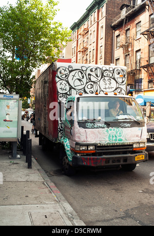 New York City, Delivery truck covered with spray paint Graffiti Stock Photo