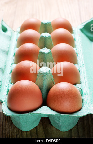 Chicken brown eggs in green box closeup Stock Photo