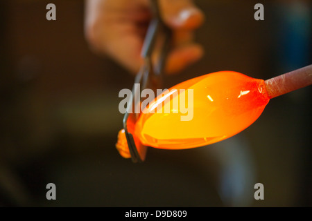 Person cutting glass with hand tool Stock Photo
