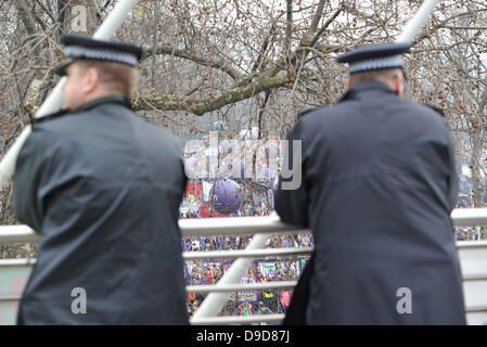 Atmosphere Protestors against spending cuts take part in TUC's 'March For The Alternative' through London. Police say they are deploying 4500 officers and are expecting crowds of 300,000 London, England - 26.03.11 Stock Photo