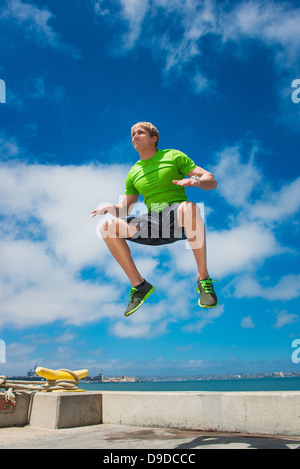 Young man jumping while fitness training Stock Photo