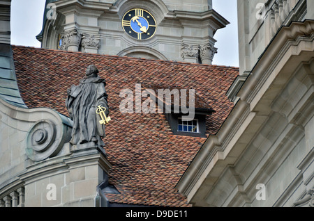 Statue of a Benedictine monk on the roof of Einsiedeln Monastery, Switzerland. Stock Photo