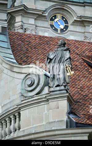 Statue of a Benedictine monk on the roof of Einsiedeln Monastery, Switzerland. Stock Photo