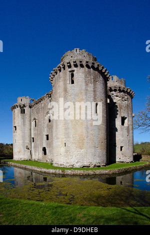 The ruins of Nunney Castle surrounded by its moat, built in the 1370s, near Frome, Somerset, England, UK Stock Photo