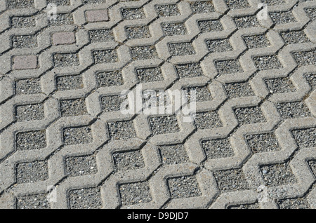 Lattice pattern of squares on a concrete pavement Stock Photo