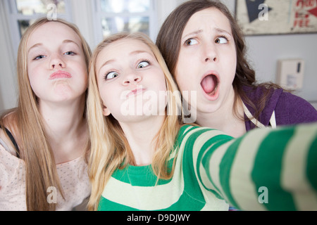 Teenagers pulling funny faces Stock Photo