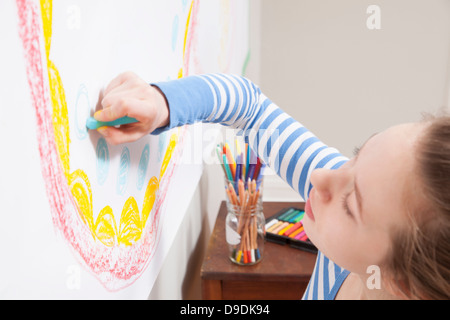 Girl drawing on wall Stock Photo