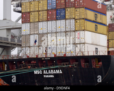 containers stacked high on the rear deck of the Panama registered msc Alabama in the port of Rotterdam, the Netherlands Stock Photo