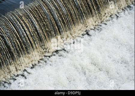 a dam overflowing river stream water weir wier UK Stock Photo - Alamy