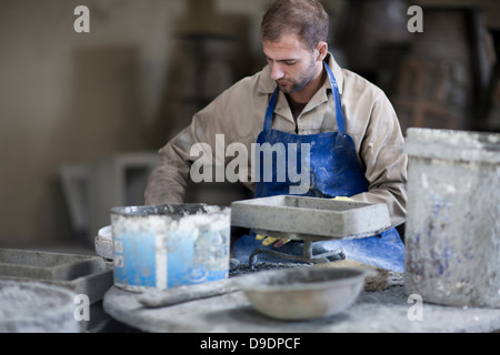 Sculpting and shaping pottery Stock Photo