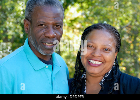 ethnically diverse mature couple, smiling and in love Stock Photo