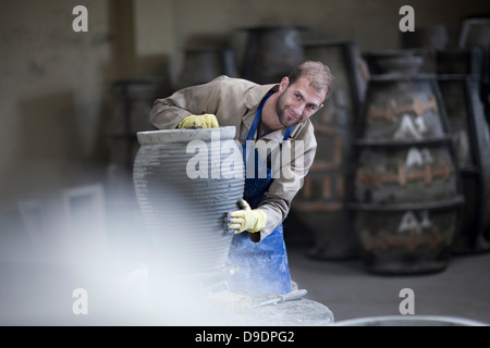 Sculpting and shaping pottery Stock Photo