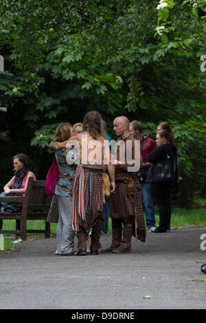 Kelvingrove Park, Glasgow, Scotland, UK, 18th June 2013. Big Peat Drums and Bagpipes traditional Scottish band play music for the locals while recording a new video. Big Peat can usually be seen in Buchanan Street in Glasgow and are quite a famous group. Paul Stewart/Alamy Live News Stock Photo