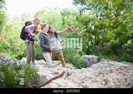 Group of young hikers on rock Stock Photo
