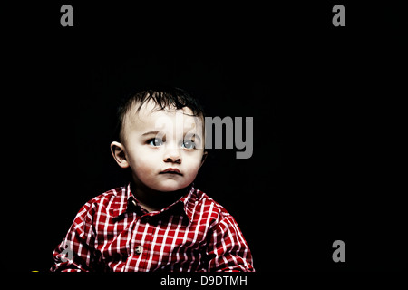 Portrait of baby boy wearing checked shirt Stock Photo