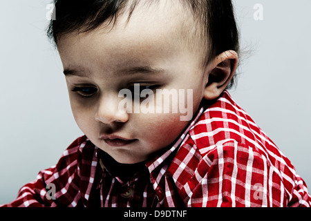 Portrait of baby boy wearing checked shirt Stock Photo