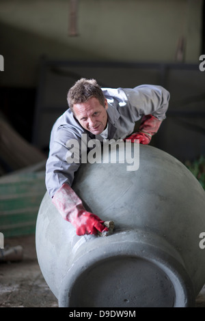 Sculpting and shaping pottery Stock Photo