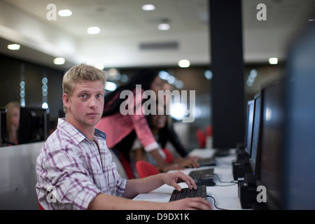 Students using computers in class Stock Photo