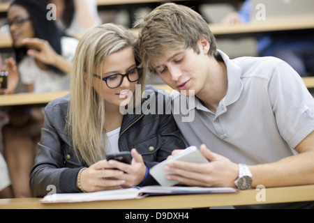 Two students looking at smartphone