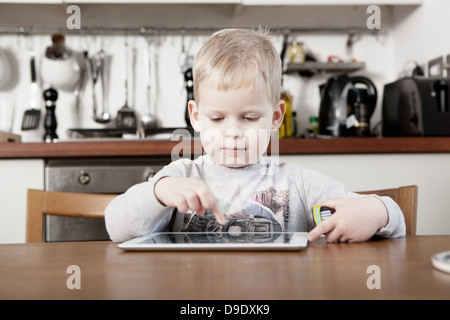 Boy using digital tablet Stock Photo